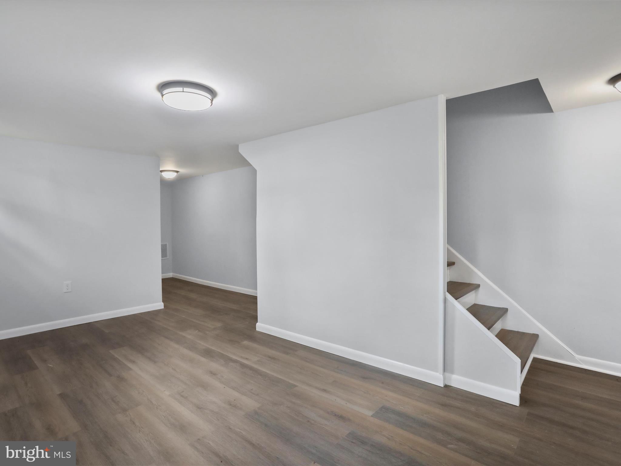 115 Blue Ridge Lane White Post, VA 22663 - Photo 18 of 35 an empty room with wooden floor and white walls