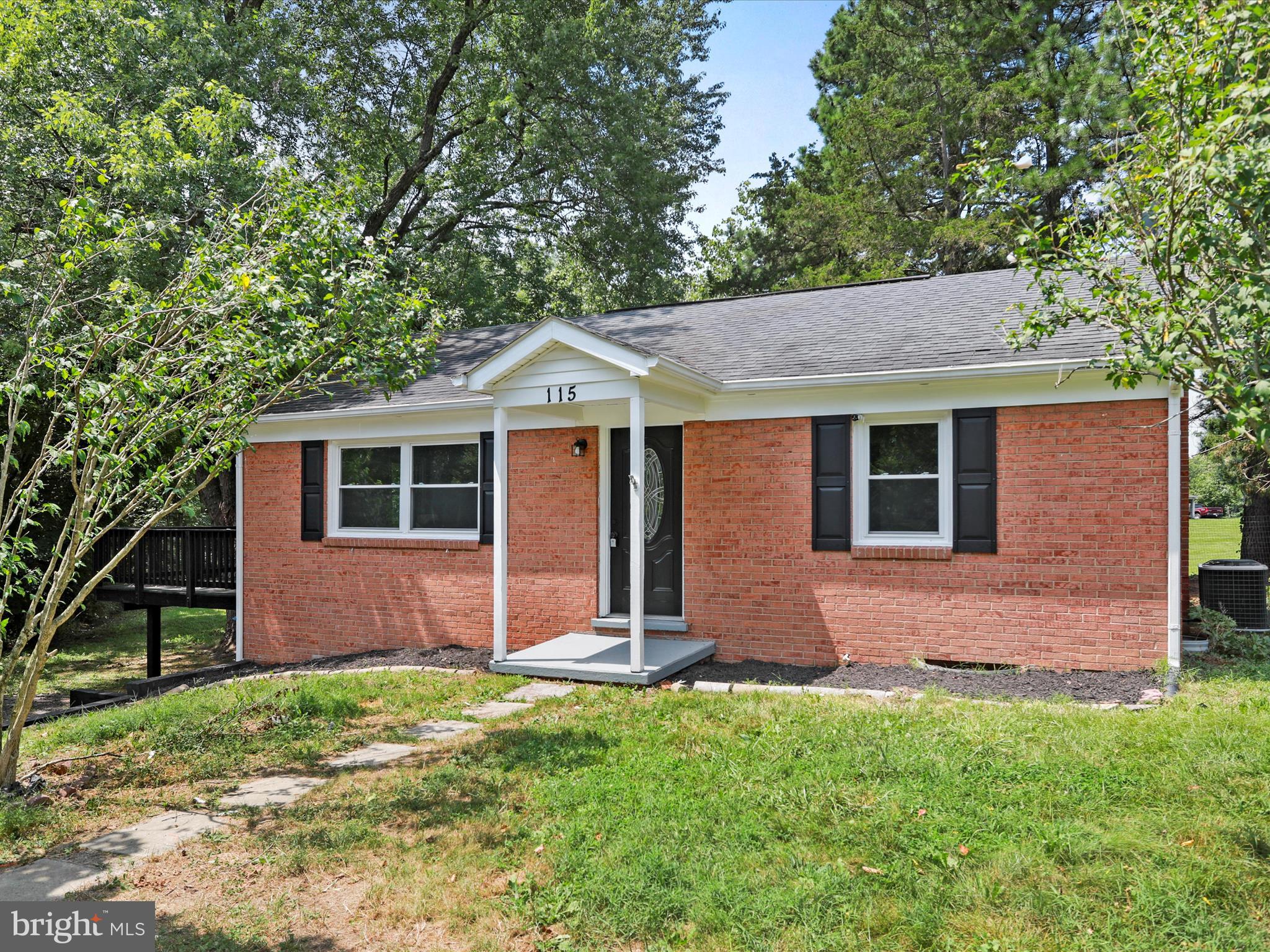 115 Blue Ridge Lane White Post, VA 22663 - Photo 35 of 35 a front view of a house with a yard and garage