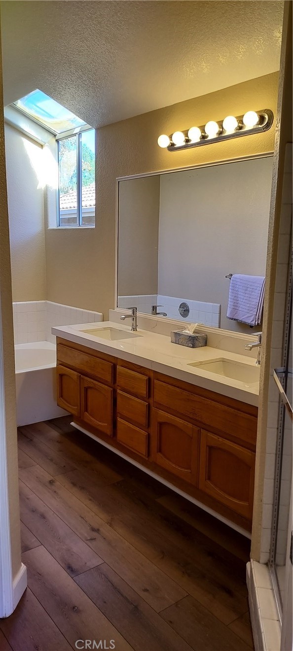 2186 Luz Way Oceanside, CA 92056 - Photo 19 of 24 a bathroom with a sink and a mirror