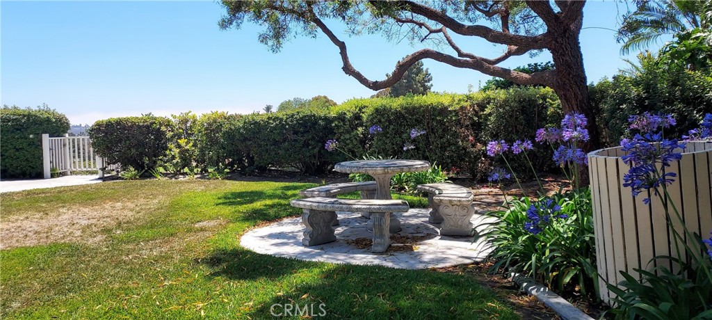2186 Luz Way Oceanside, CA 92056 - Photo 23 of 24 a view of a chair and table in backyard of the house