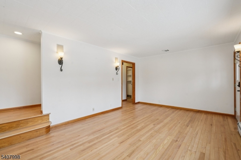 20 Fairmount Road New Providence, NJ 07974 - Photo 11 of 23 a view of an empty room with wooden floor