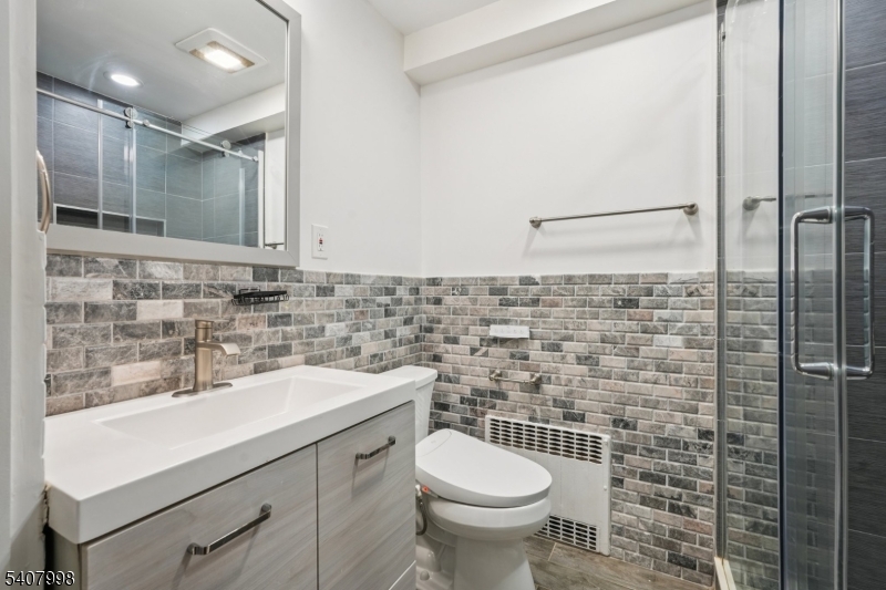 20 Fairmount Road New Providence, NJ 07974 - Photo 12 of 23 a bathroom with a sink a toilet and shower