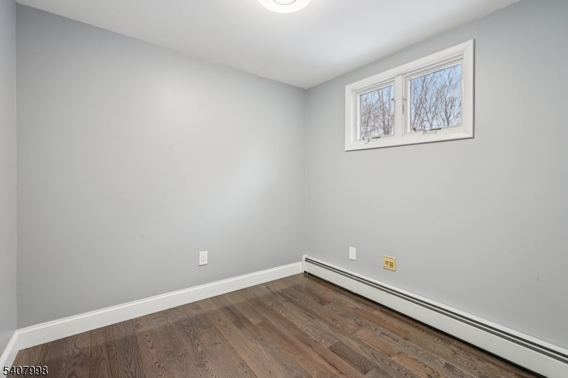 20 Fairmount Road New Providence, NJ 07974 - Photo 18 of 23 a view of an empty room with wooden floor