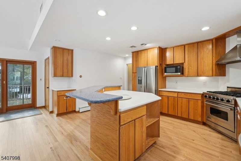 20 Fairmount Road New Providence, NJ 07974 - Photo 7 of 23 a kitchen with stainless steel appliances granite countertop a sink stove and refrigerator