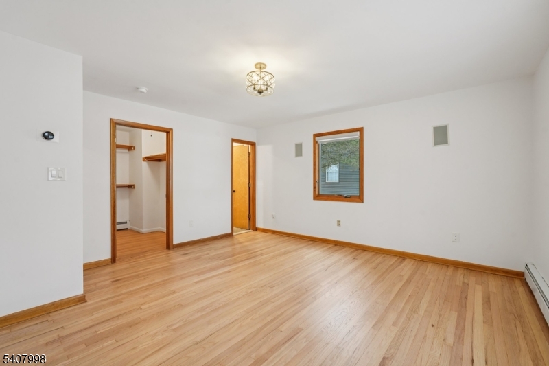 20 Fairmount Road New Providence, NJ 07974 - Photo 9 of 23 an empty room with wooden floor and windows