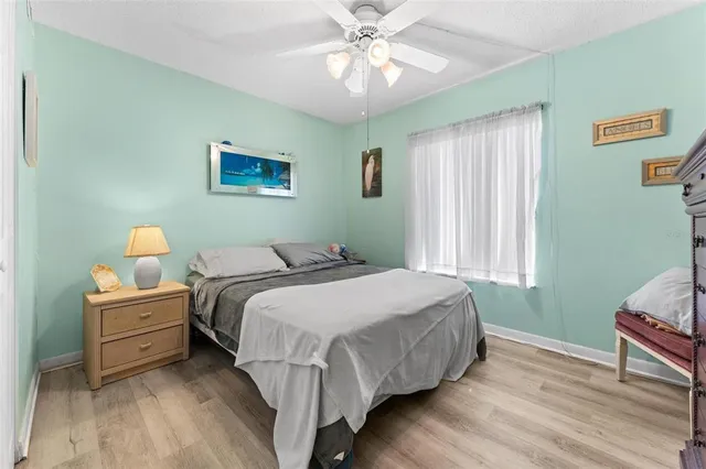 a bedroom with bed and window