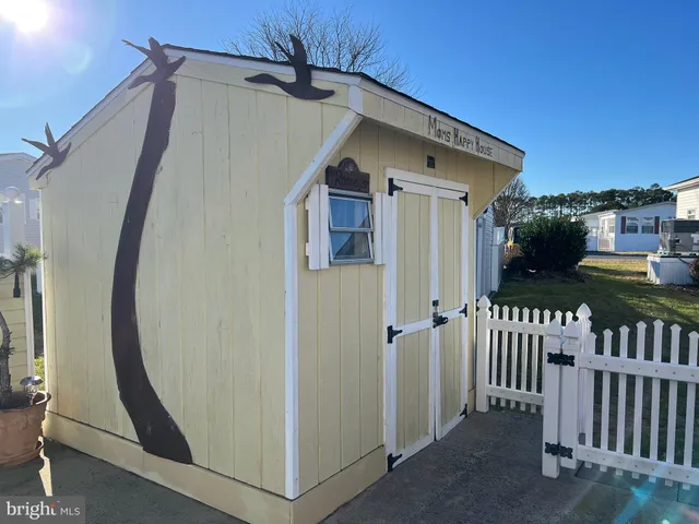 a view of a room with table and chairs