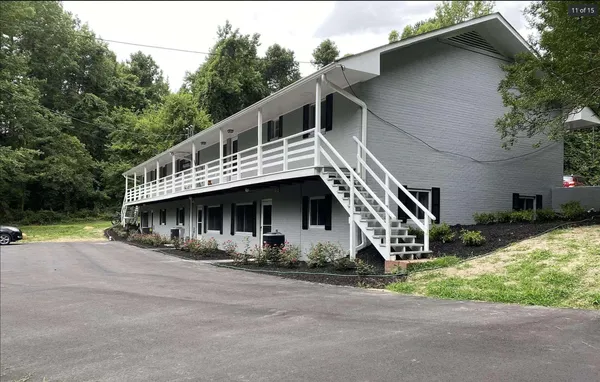 a house with trees in the background