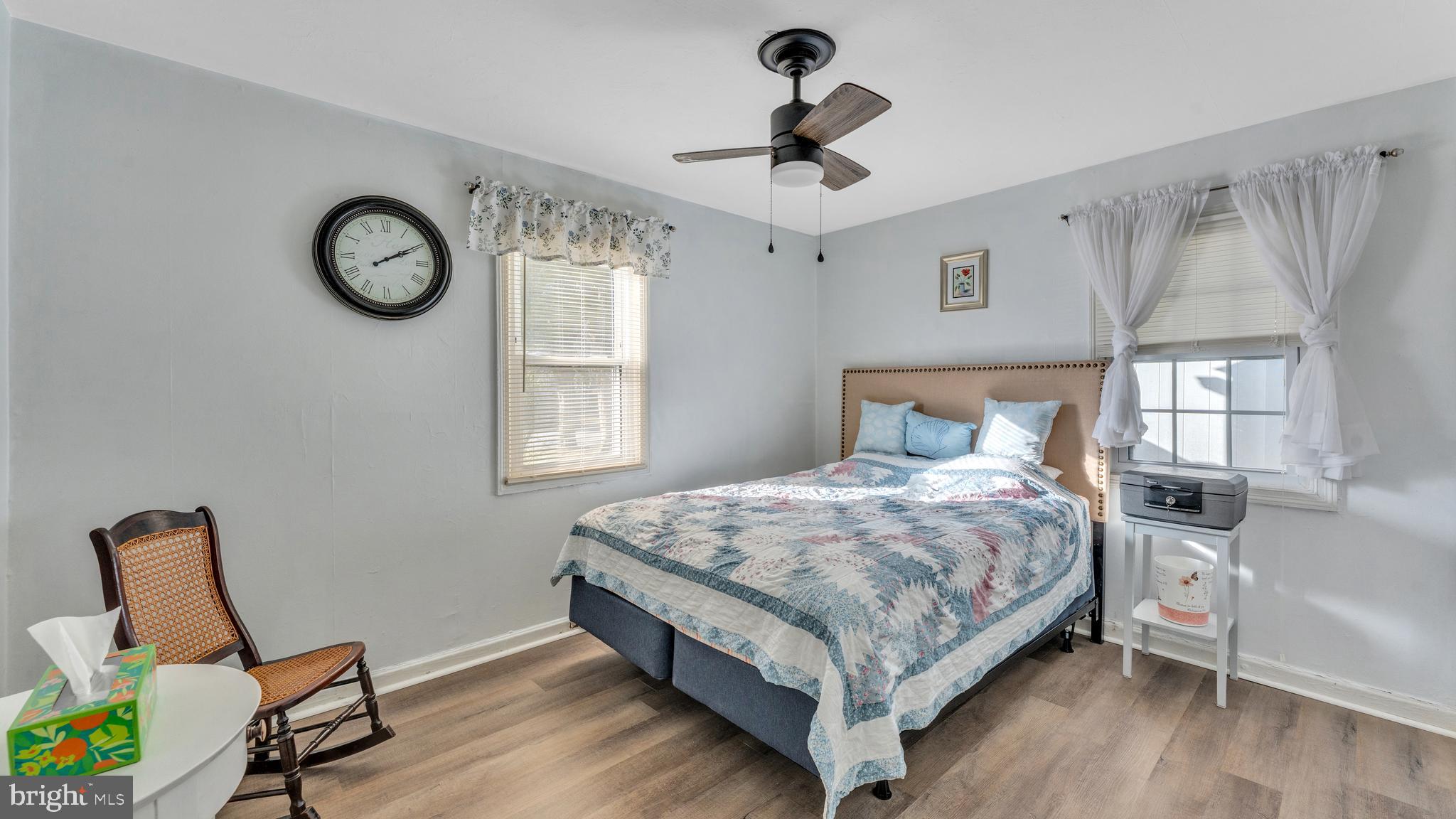 1065 Janes Road Dover, DE 19901 - Photo 13 of 23 a bedroom with a bed a chandelier and a window