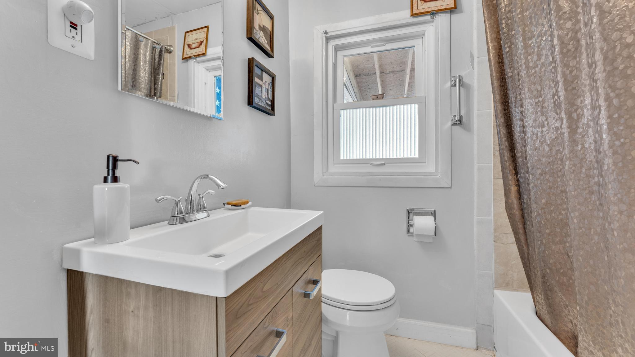 1065 Janes Road Dover, DE 19901 - Photo 15 of 23 a bathroom with a sink toilet and mirror