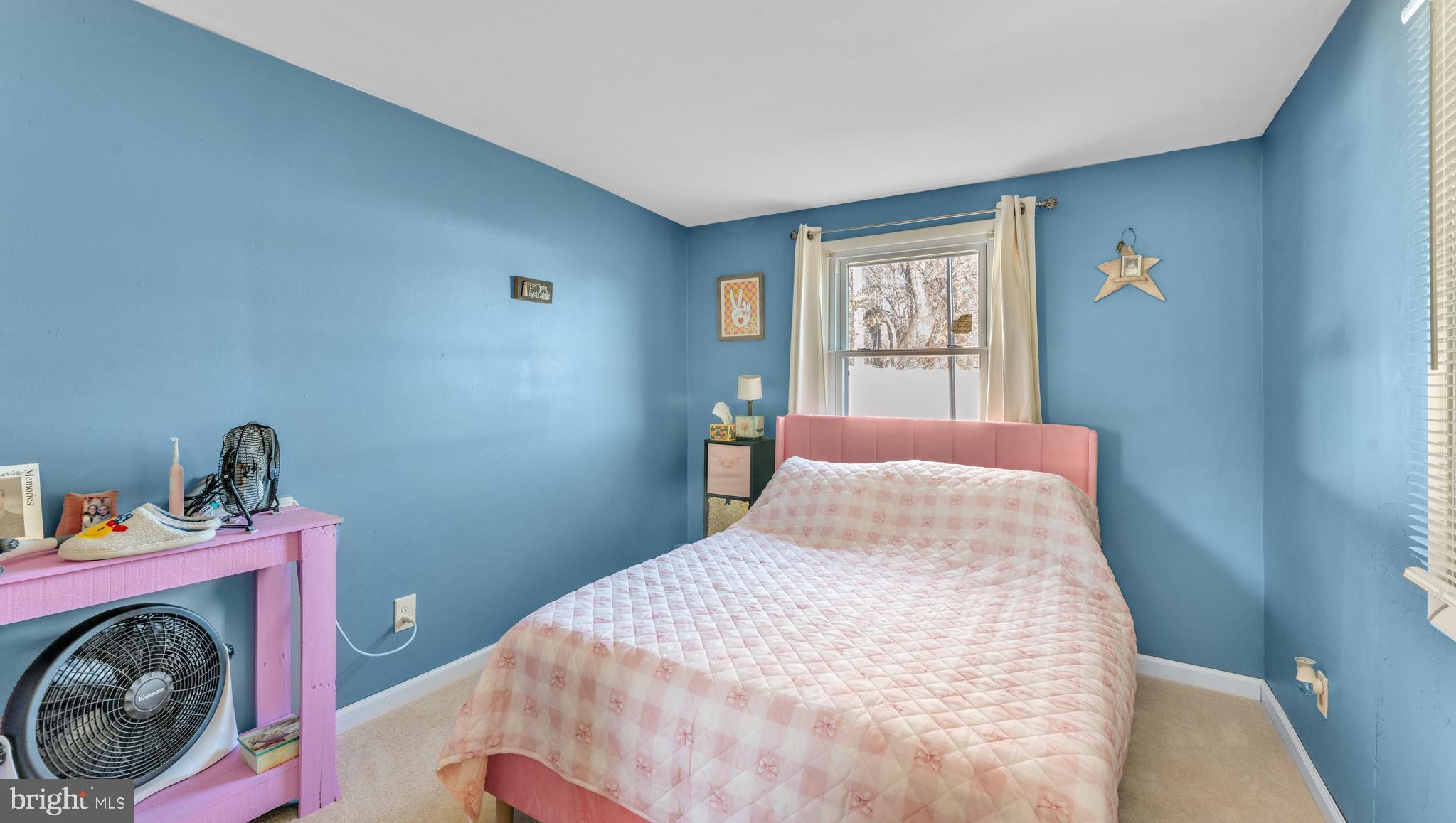 1065 Janes Road Dover, DE 19901 - Photo 17 of 23 a bedroom with a bed and a wooden floor