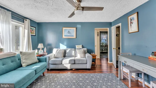a living room with furniture and a rug