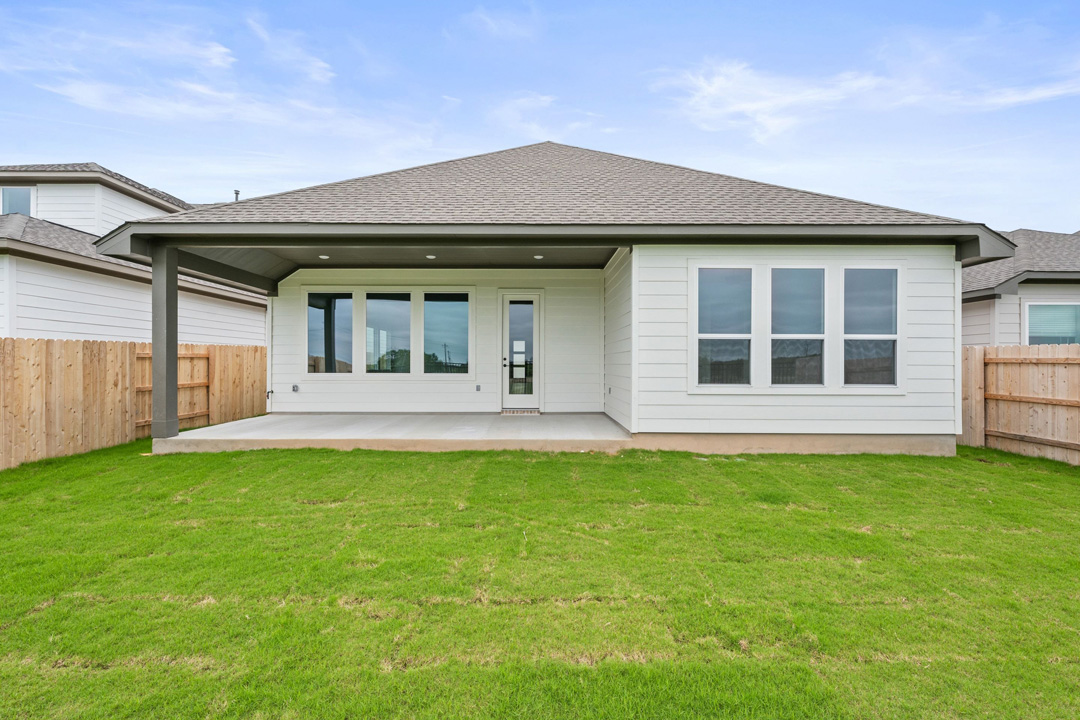 16201 Smithers Road Manor, TX 78653 - Photo 37 of 40 a view of a house with a backyard
