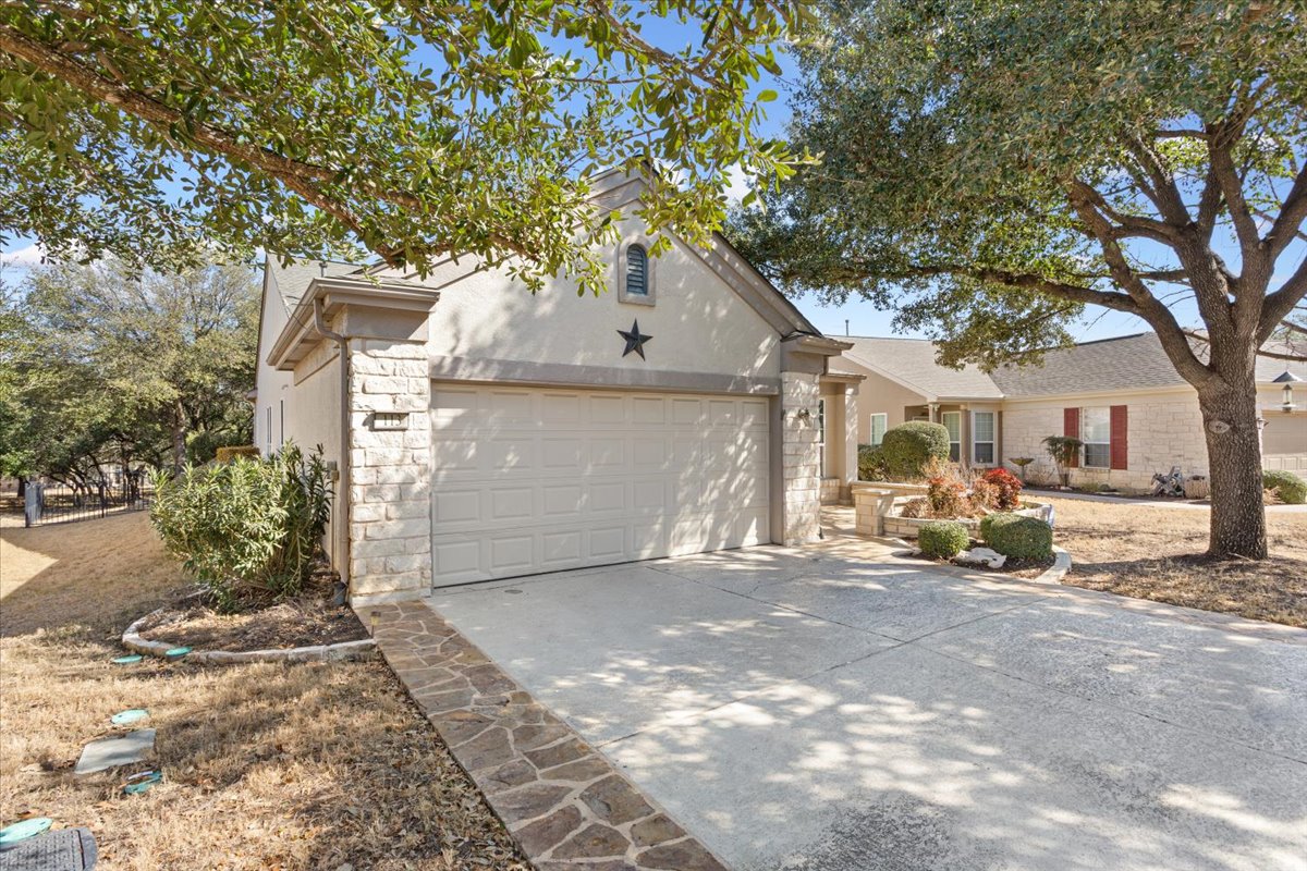 113 Sunny Side Bend Georgetown, TX 78633 - Photo 4 of 33 Side extensions on both sides of this driveway give a little extra space getting out of your vehicls.
