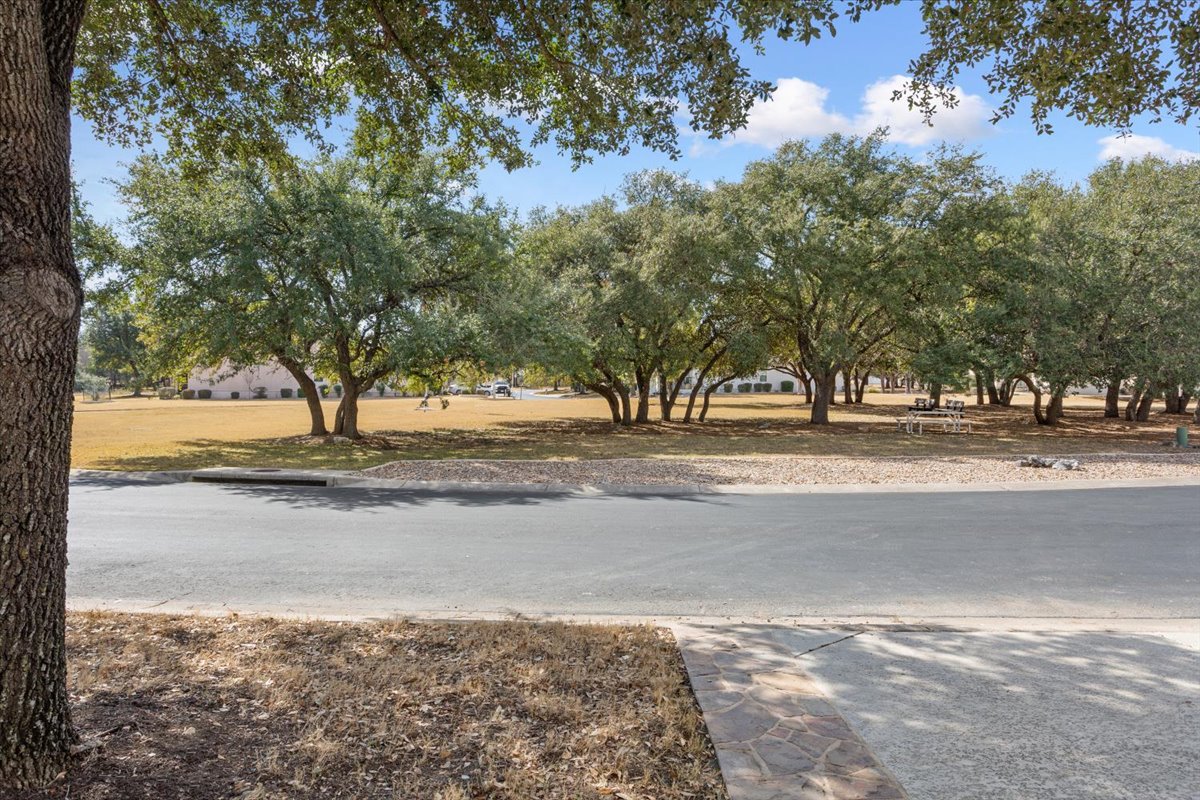 113 Sunny Side Bend Georgetown, TX 78633 - Photo 7 of 33 Pocket park right across the street offers a bench to enjoy some quiet time.