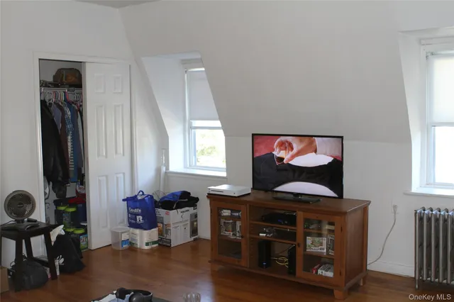 a living room with furniture and flat screen tv