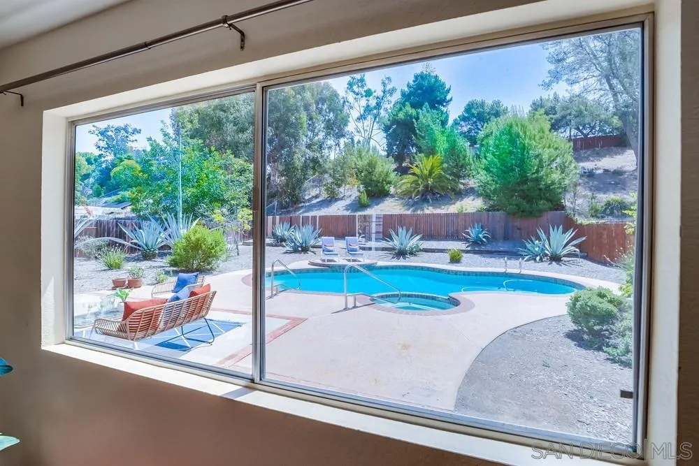 7214 Durango Circle Carlsbad, CA 92011 - Photo 12 of 37 a view of a living room and floor to ceiling window