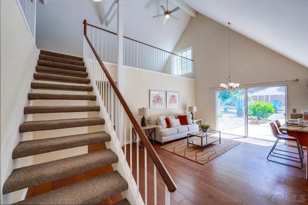 7214 Durango Circle Carlsbad, CA 92011 - Photo 13 of 37 a living room with furniture and wooden floor