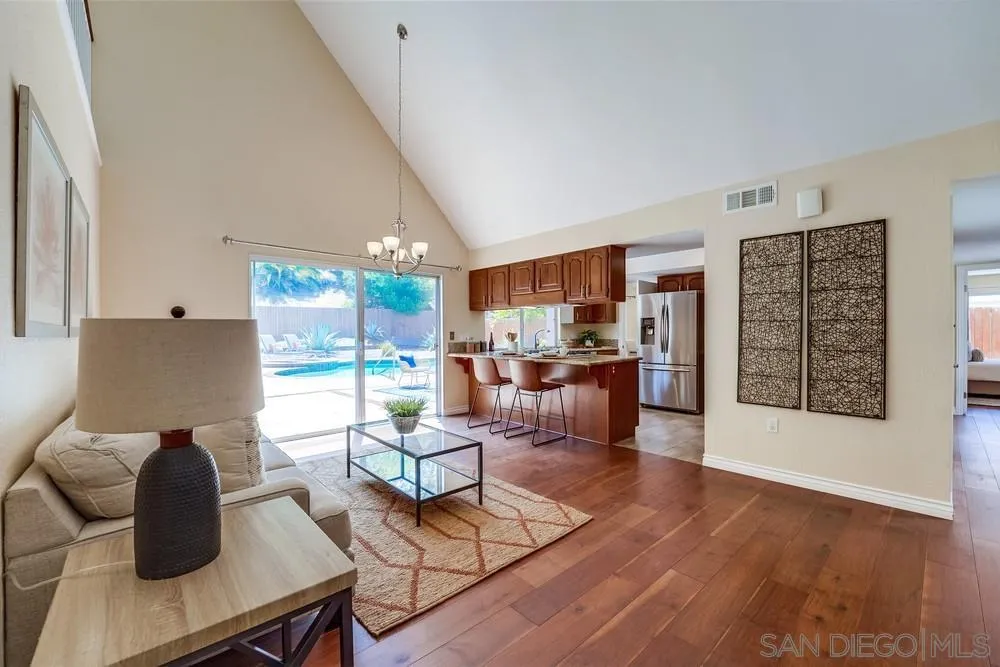 7214 Durango Circle Carlsbad, CA 92011 - Photo 15 of 37 a living room with furniture and a wooden floor