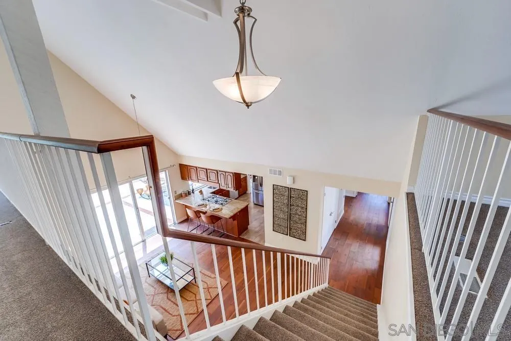 7214 Durango Circle Carlsbad, CA 92011 - Photo 24 of 37 a view of staircase with furniture and a window