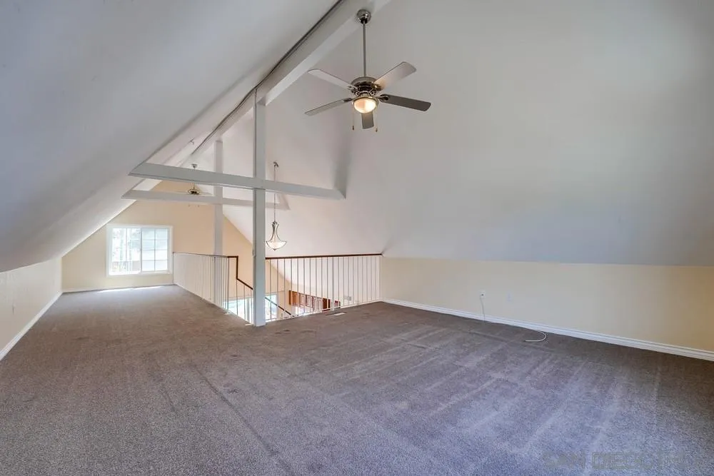 7214 Durango Circle Carlsbad, CA 92011 - Photo 25 of 37 an empty room with windows and fan
