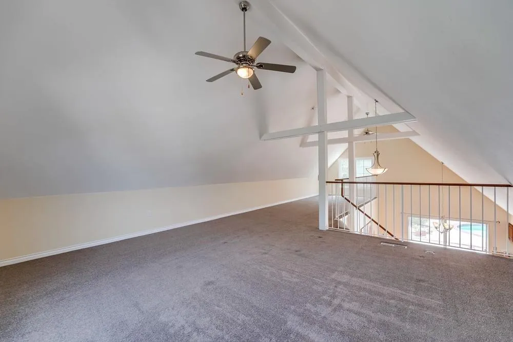 7214 Durango Circle Carlsbad, CA 92011 - Photo 27 of 37 an empty room with windows and fan