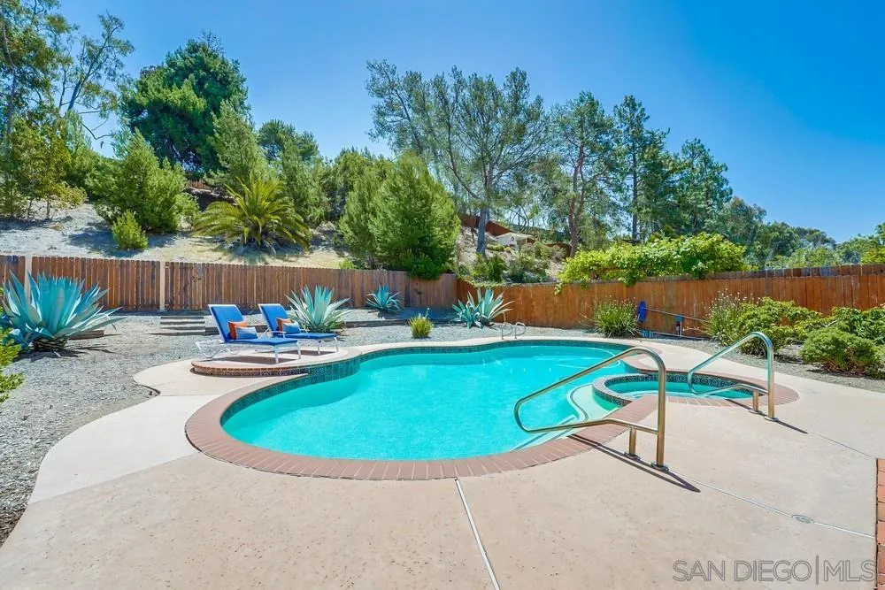 7214 Durango Circle Carlsbad, CA 92011 - Photo 33 of 37 a view of a swimming pool with lounge chairs