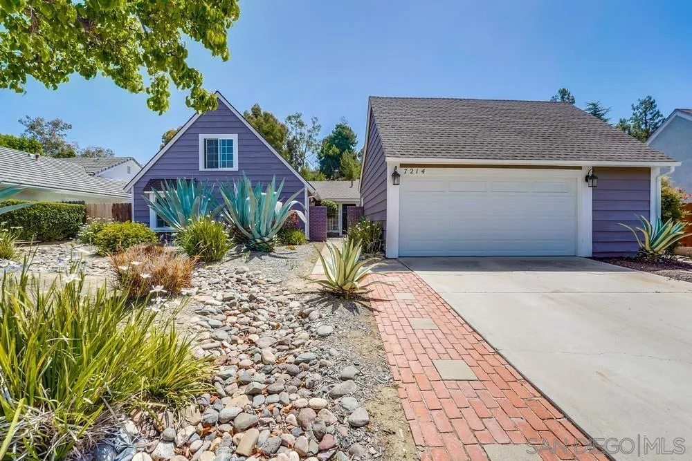 7214 Durango Circle Carlsbad, CA 92011 - Photo 4 of 37 a front view of a house with a garden