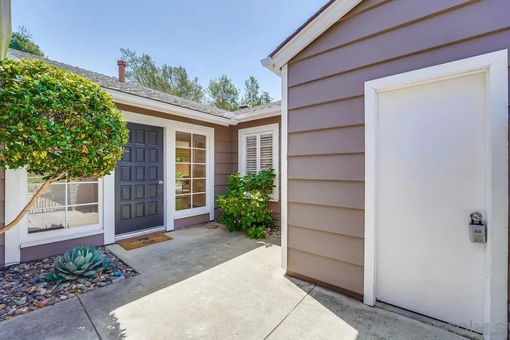 7214 Durango Circle Carlsbad, CA 92011 - Photo 7 of 37 a front view of a house with a yard