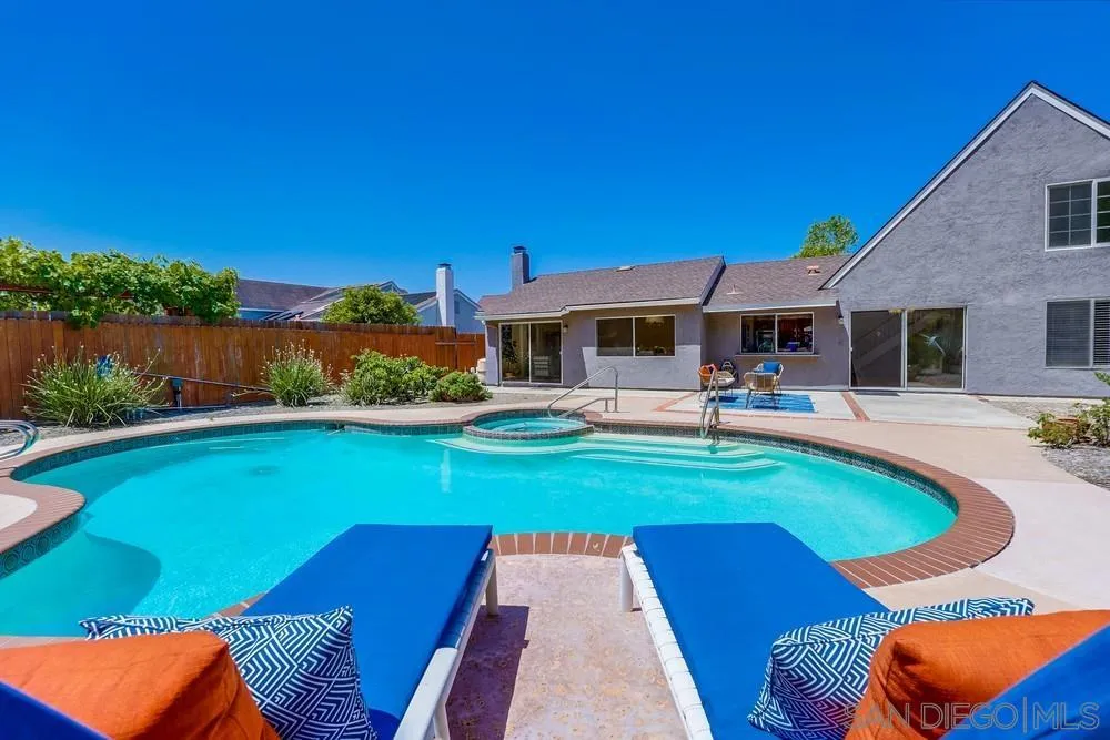 7214 Durango Circle Carlsbad, CA 92011 - Photo 8 of 37 a swimming pool with outdoor seating and yard