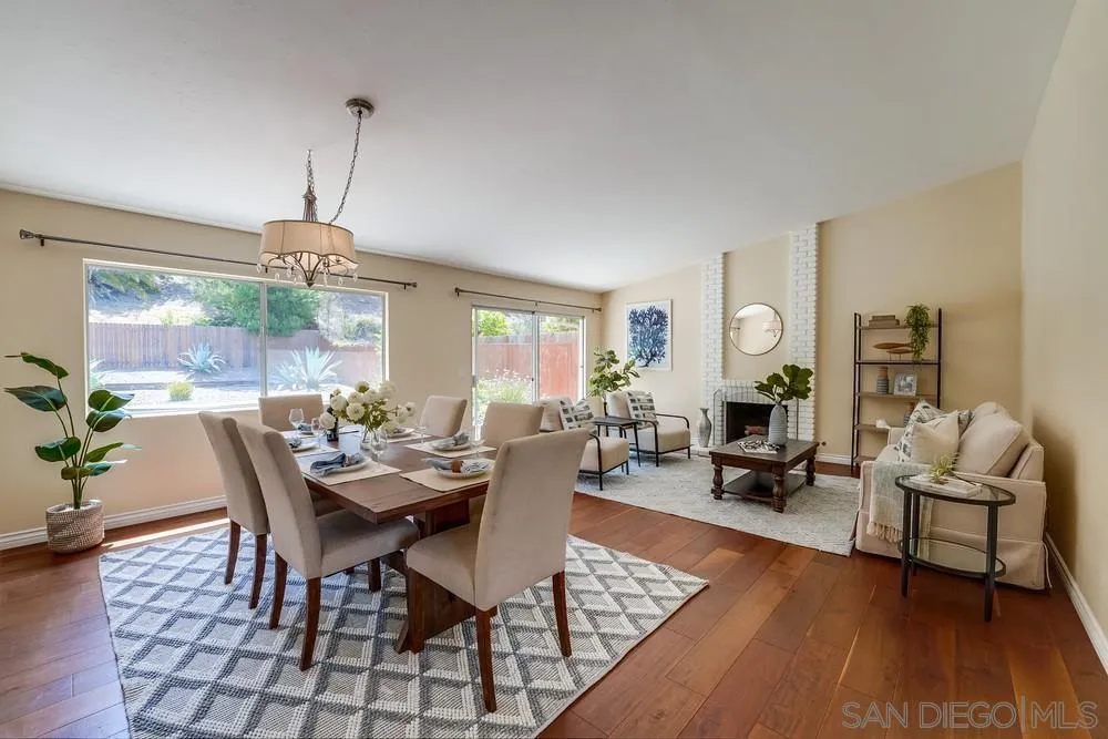 7214 Durango Circle Carlsbad, CA 92011 - Photo 9 of 37 a view of a dining room with furniture window and wooden floor