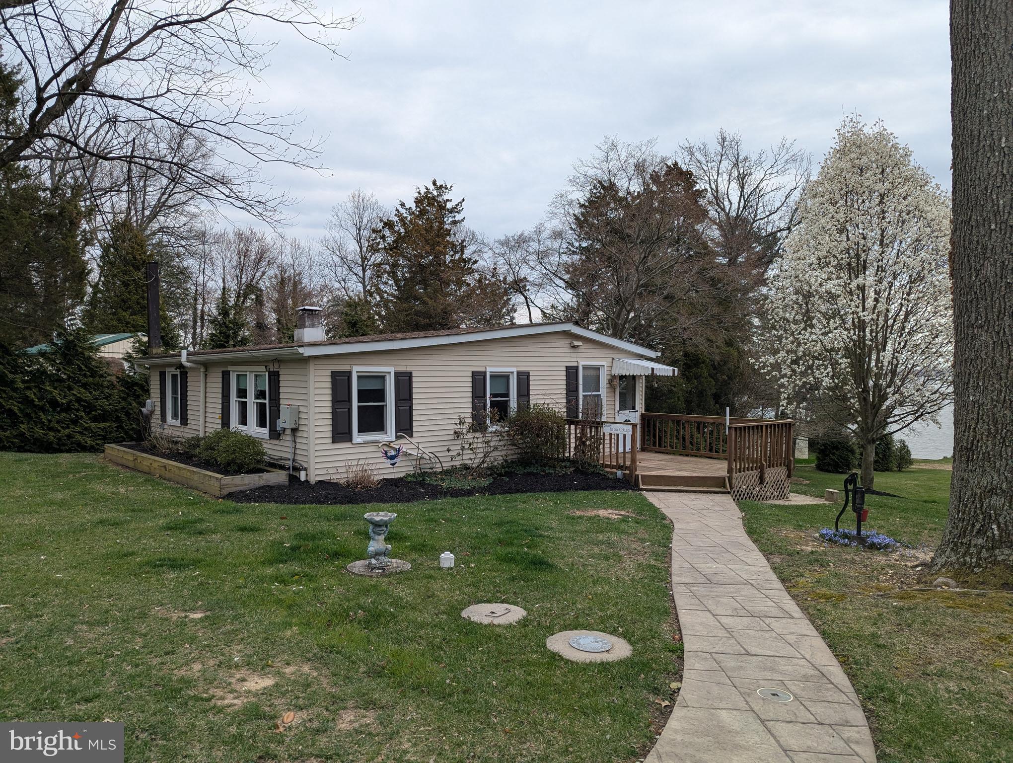 3729 Abingdon Beach Road Abingdon, MD 21009 - Photo 11 of 85 a front view of a house with a garden
