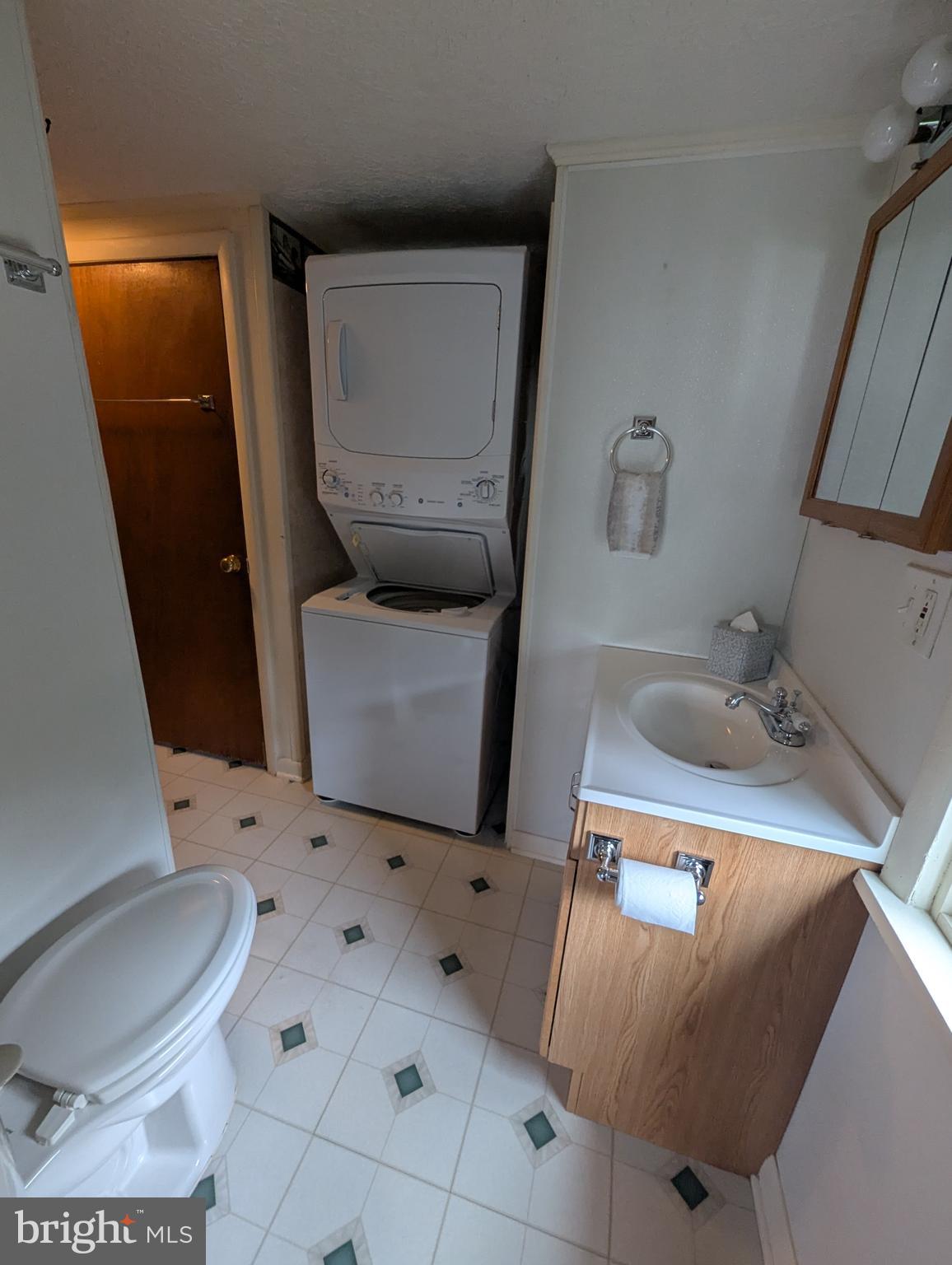 3729 Abingdon Beach Road Abingdon, MD 21009 - Photo 28 of 85 a bathroom with a toilet sink and mirror