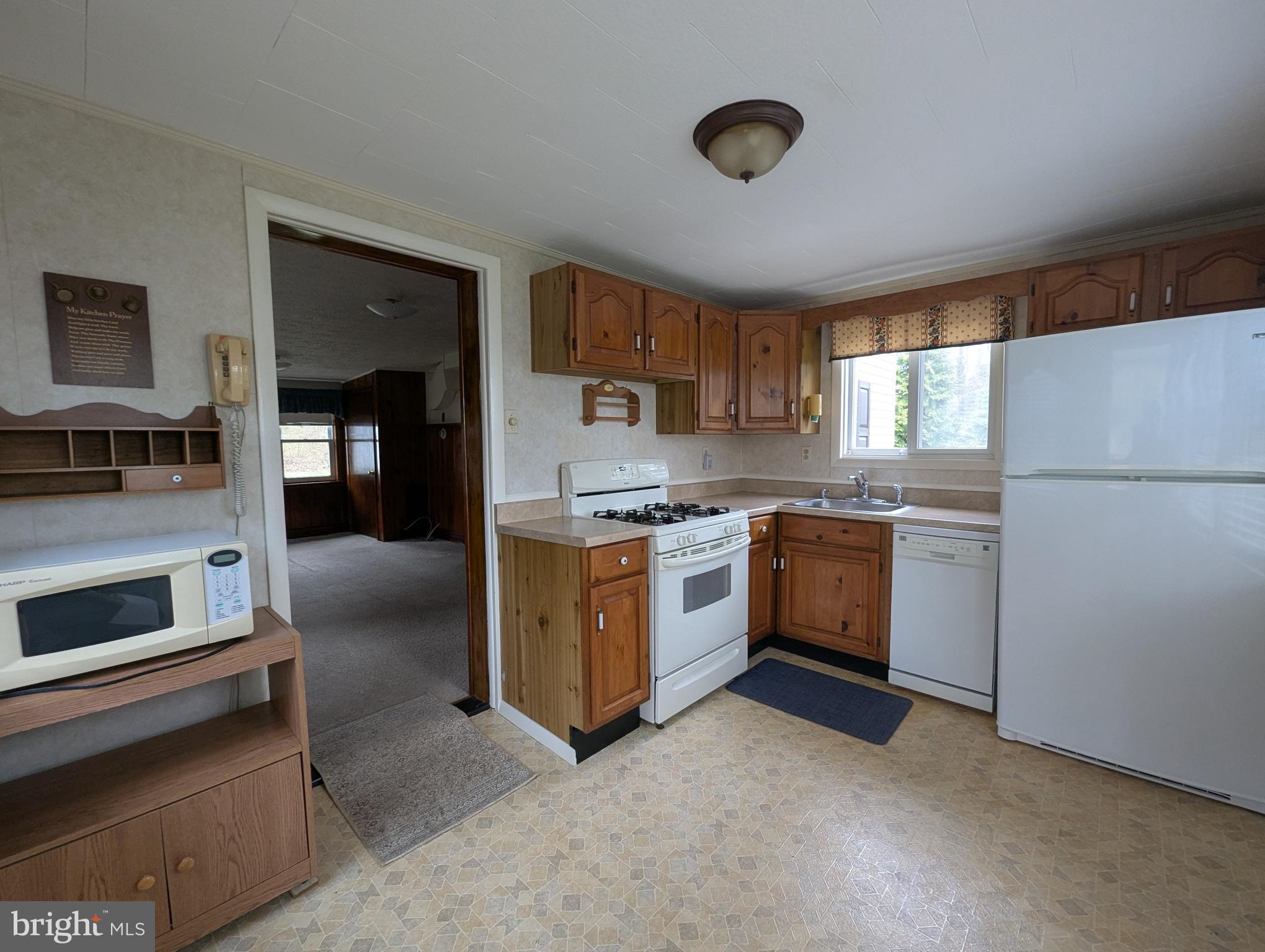 3729 Abingdon Beach Road Abingdon, MD 21009 - Photo 30 of 85 a kitchen with stainless steel appliances granite countertop a stove a sink and a refrigerator
