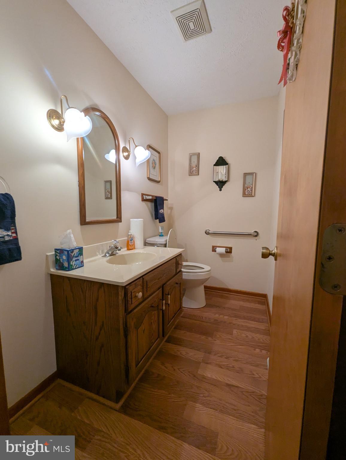 3729 Abingdon Beach Road Abingdon, MD 21009 - Photo 39 of 85 a bathroom with a sink and a mirror