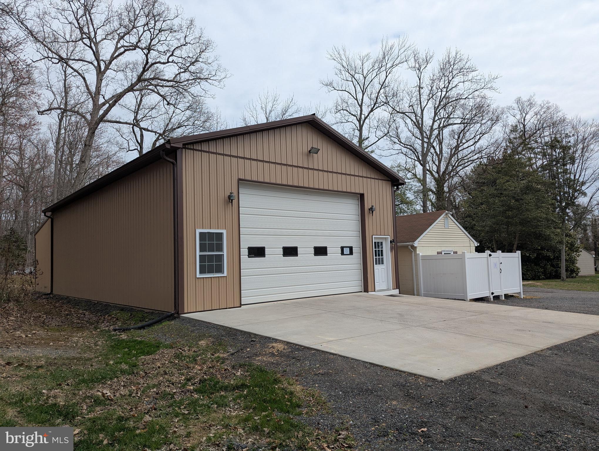 3729 Abingdon Beach Road Abingdon, MD 21009 - Photo 5 of 85 a front view of a house with a yard and garage