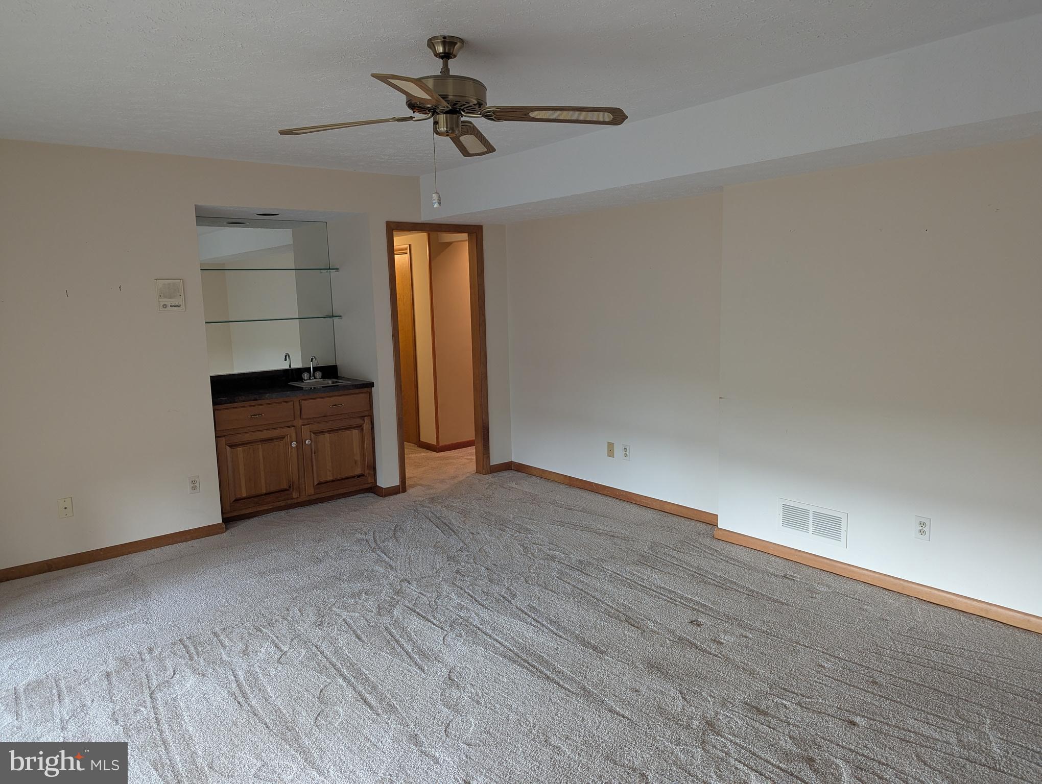 3729 Abingdon Beach Road Abingdon, MD 21009 - Photo 68 of 85 a view of empty room with wooden floor and ceiling fan