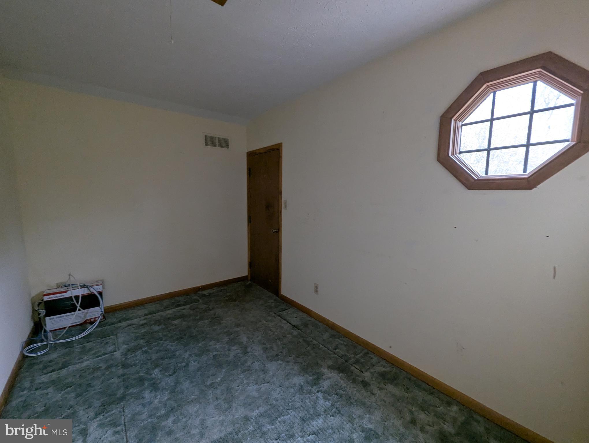 3729 Abingdon Beach Road Abingdon, MD 21009 - Photo 85 of 85 an empty room with a window