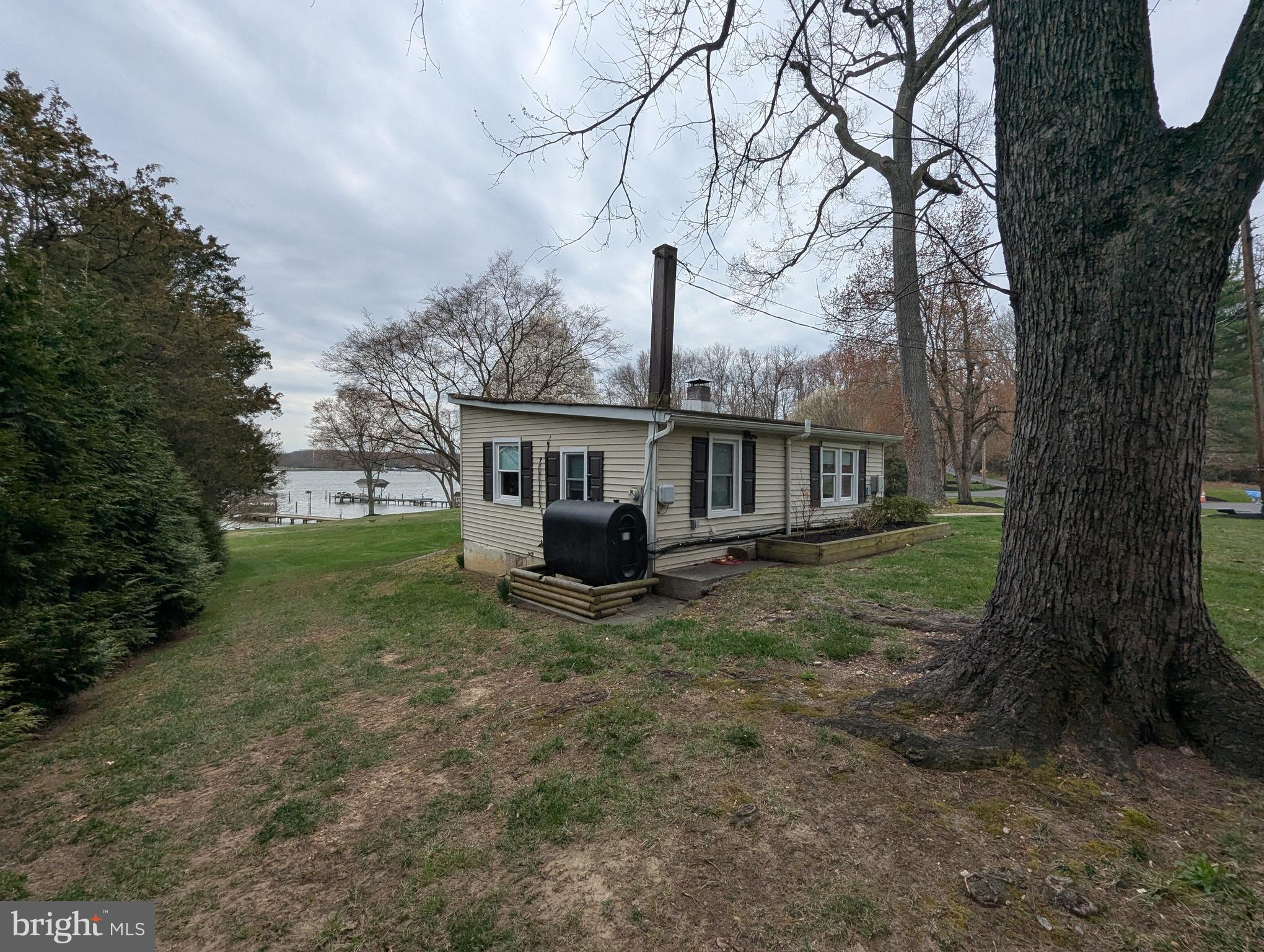 3729 Abingdon Beach Road Abingdon, MD 21009 - Photo 9 of 85 a view of a house with a yard