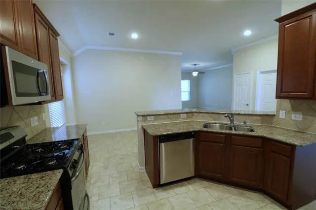 a kitchen with a sink and cabinets