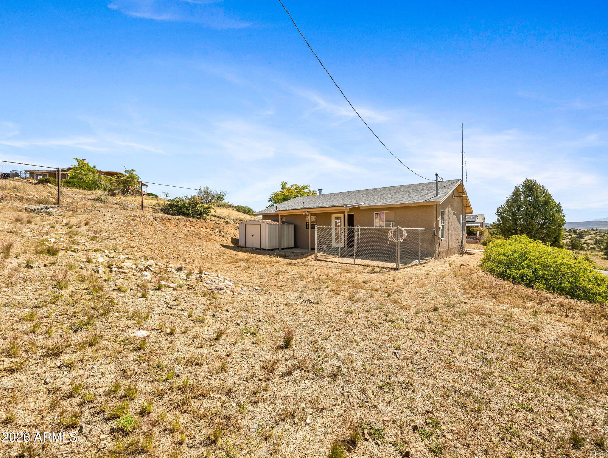 18420 Peeples Valley Road Peeples Valley, AZ 86332 - Photo 25 of 31 a front view of a house with a yard