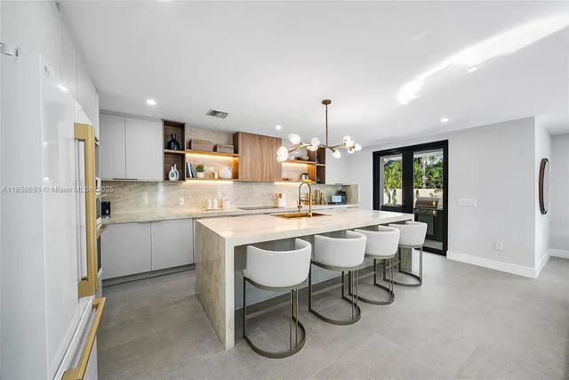 a view of a livingroom with furniture and stairs