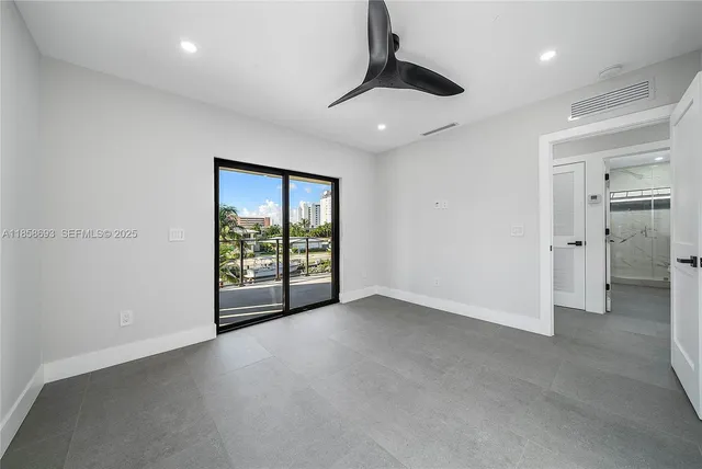 a room with a fireplace and a painting on the wall