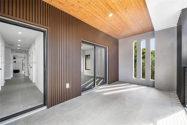 a view of a house with a yard and a sitting area