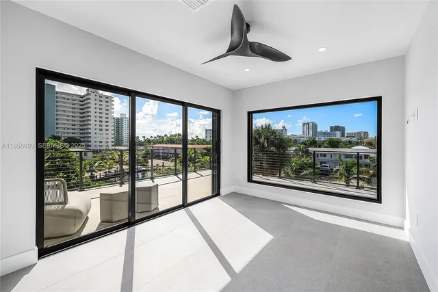 a view of a city street and ocean view