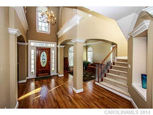 3413 Rhett Butler Place Charlotte, NC 28270 - Photo 2 of 15 a view of entryway with stairs and wooden floor