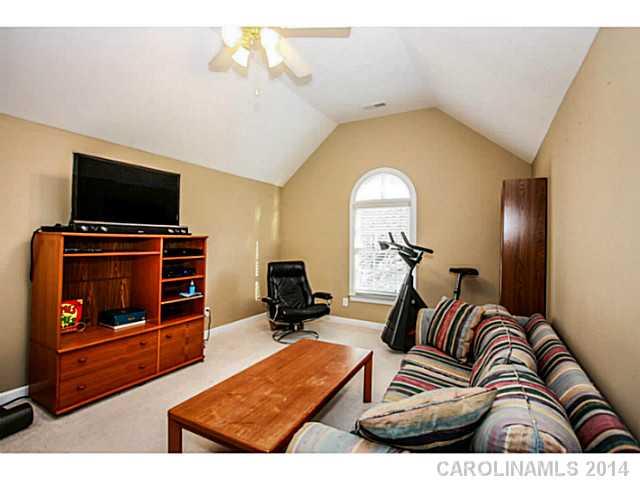 3413 Rhett Butler Place Charlotte, NC 28270 - Photo 12 of 15 a living room with furniture and a flat screen tv