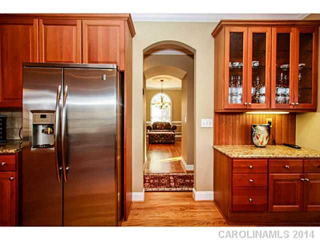 3413 Rhett Butler Place Charlotte, NC 28270 - Photo 4 of 15 a view of kitchen with stainless steel appliances granite countertop a refrigerator and a sink