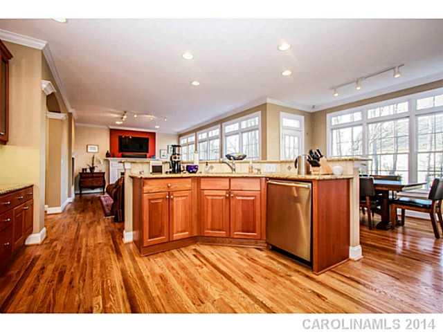 3413 Rhett Butler Place Charlotte, NC 28270 - Photo 5 of 15 a open kitchen with sink cabinets and wooden floor