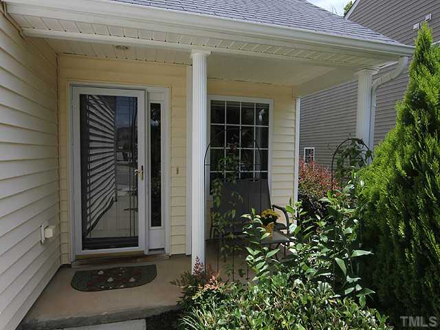 1621 Cricket Ridge Drive Raleigh, NC 27610 - Photo 3 of 25 Cute front porch to sit outside and relax and enjoy the view of this lovely yard.